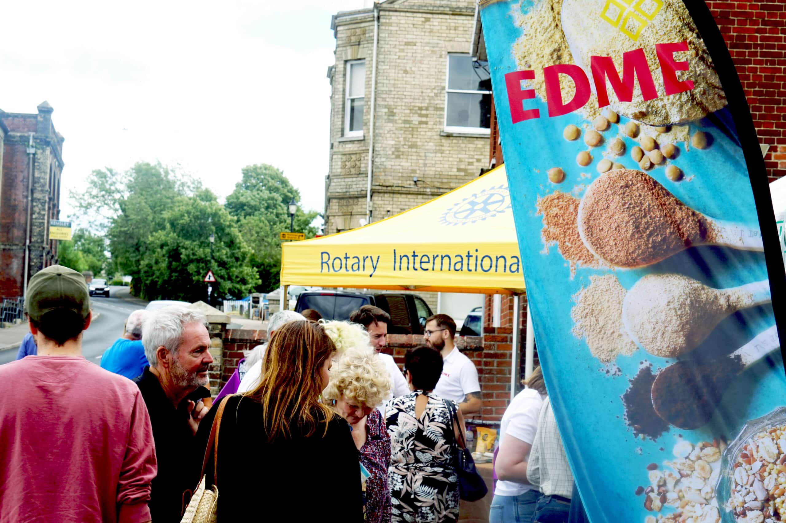 Members of community gather to collect maps and hear about EDME'S history, processes and ingredients