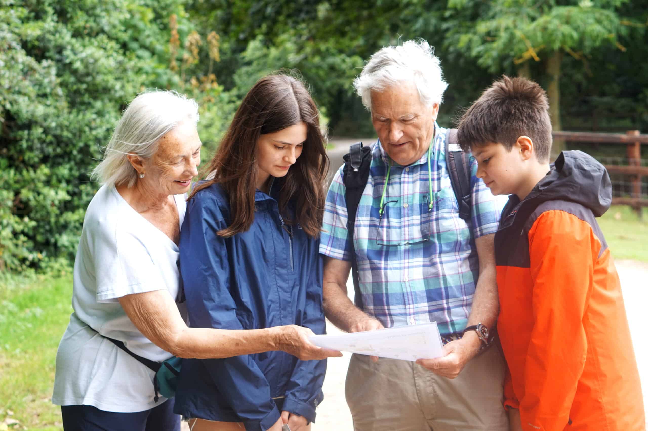 Members of community study map and visit organisations on mystery trail