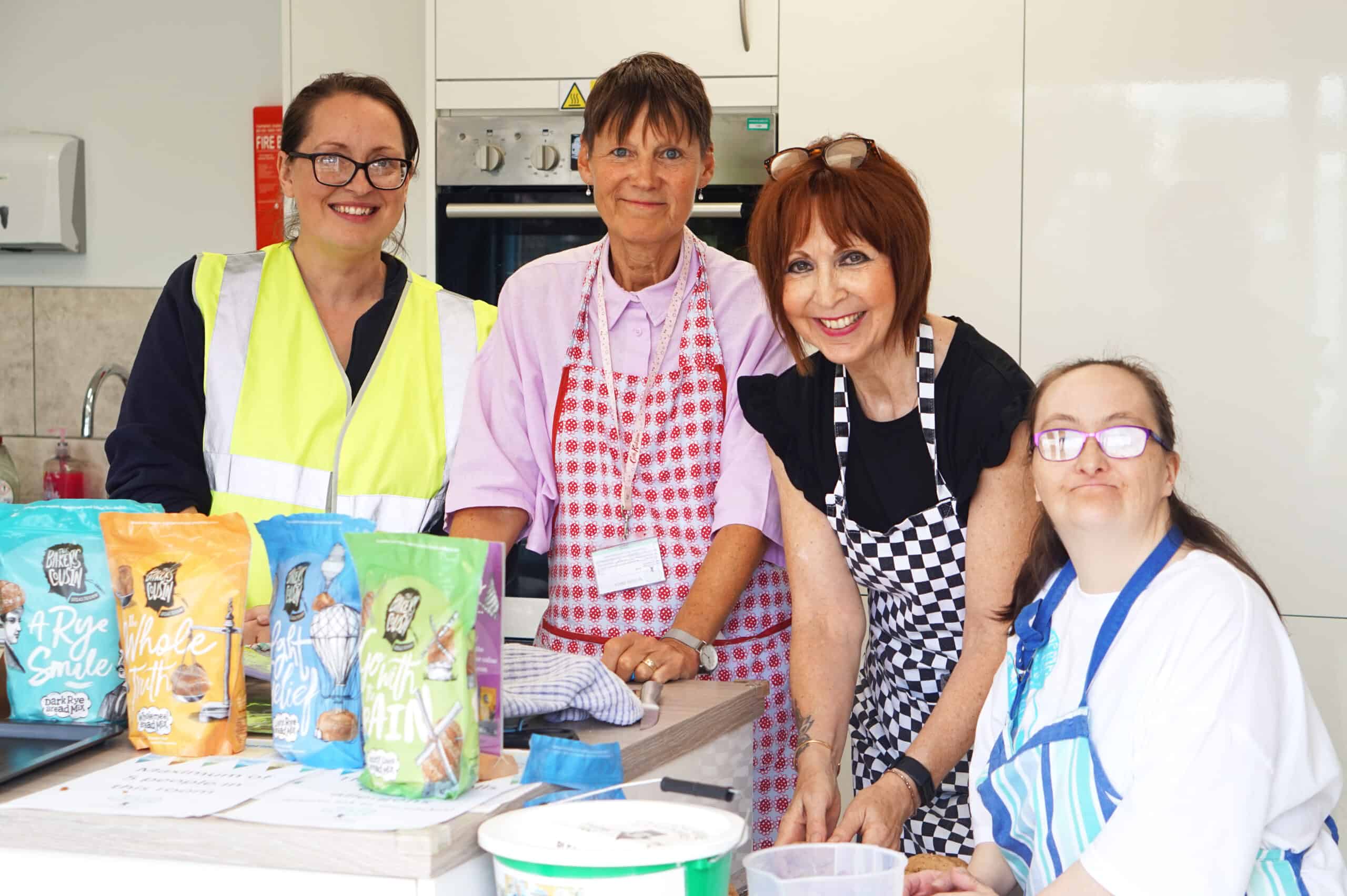 Official Charity of the event Acorn Village getting hands on baking bread mixes by The Bakers Cousin