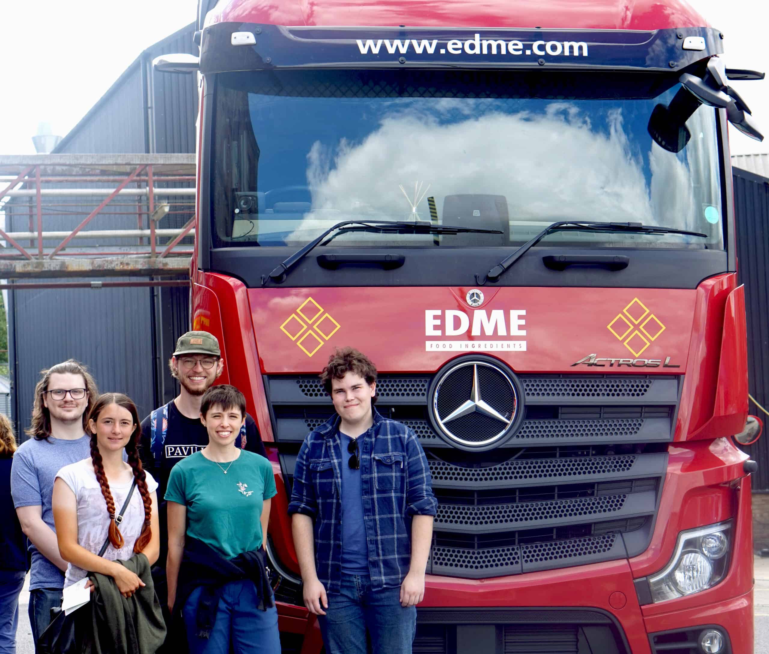 Trail-goers taking photo opportunity outside of EDME lorry